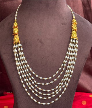 The Nivriti Silver Layered Peacock Pearl Necklace